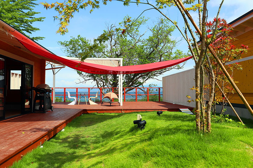 Private deck and grassy courtyard