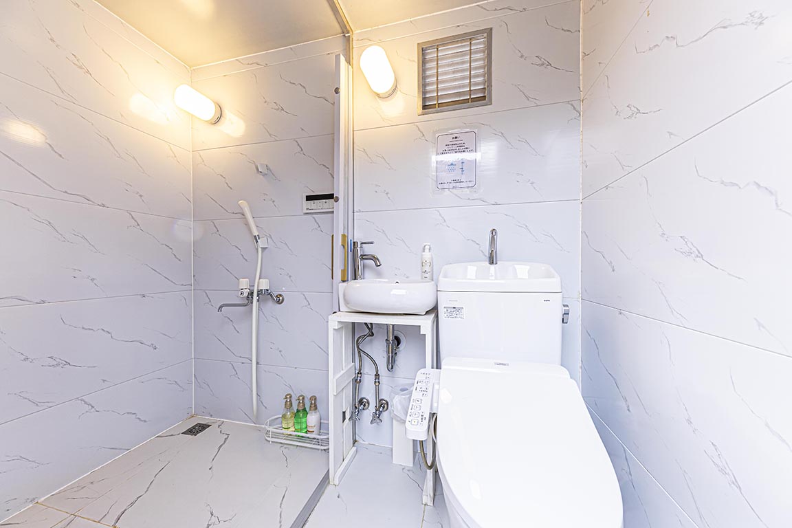 Separate toilet/shower booth