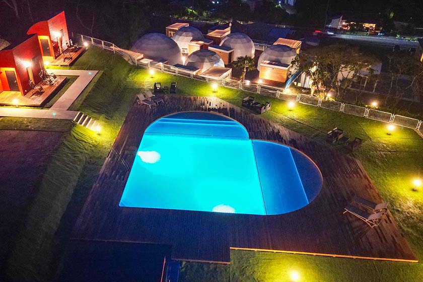 Large heart-shaped pool at Tsurigasaki Glamping Resort